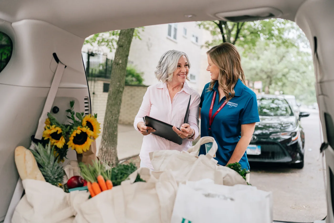 A Homewatch caregiver preparing a meal with a client